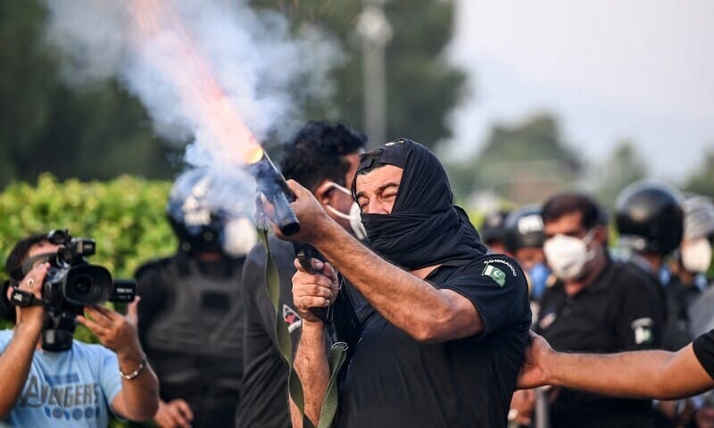 Islamabad remained tense on Friday . The day was marked by Road closures , blockades, arrests, Tear Gas , Smoke and mobile service suspension amid PTI protests .