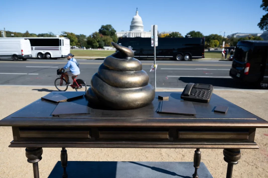 Mysterious Statues Appear in D.C., Including a Poop Sculpture on Pelosi's Desk